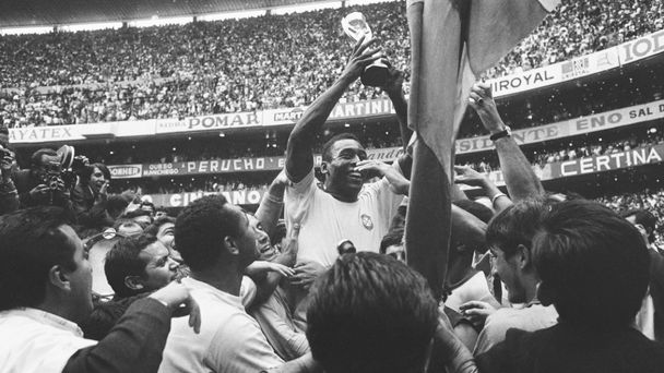 Pele holding world cup trophy